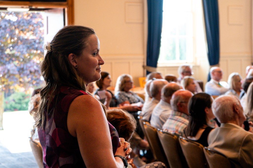 Side profile of Danielle looking over event